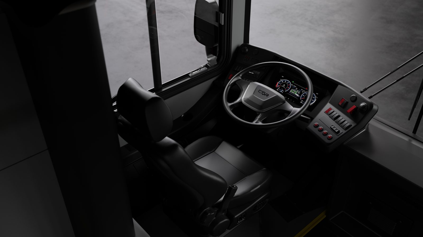 Operator seat, steering wheel and digital dash inside the COR Transit bus